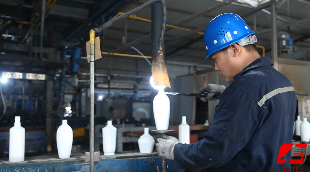 Thumbnail: Worker at an opal glass production line