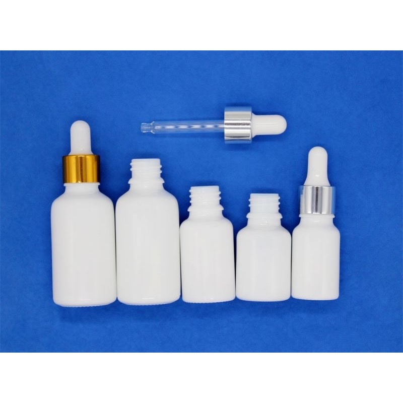 Thumbnail: Milky white opal dropper bottle and closure assortment on blue.